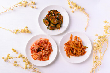 Kimchi cabbage, radish and cucumber  on white background, Korean food homemade side dish, Top view