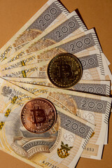 Bitcoin gold coin on bills of 200 polish zloty currency. Bitcoin mining trading concept. BTC golden money spinning around. Worldwide virtual internet Cryptocurrency or crypto digital payment system