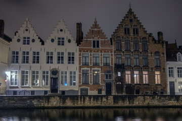 Fototapeta na wymiar Cityscape with old buildings and embankment in the evening city of Bruges (Belgium)