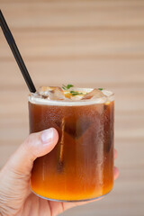 Iced coffee with orange in coffee shop