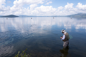 Trout fishing, preparing the line, Lake Rotorua