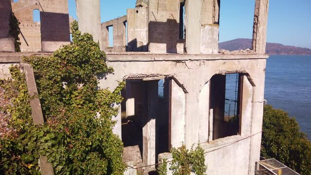Gimbal tilting up shot of the ruins of the Guard House on Alcatraz Island in the San Francisco Bay. 4K