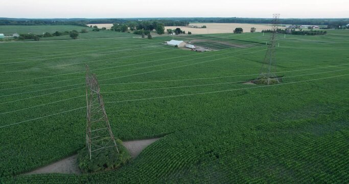 Parallax Circle Around Cinematic Flyover of Power Lines Farmland Farm Country