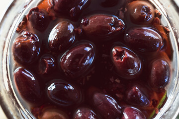 black kalamata olive jar close-up shot, concept of simple natural healthy ingredients