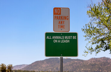 No parking any time and all animals must be on a leash signs.