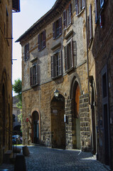 Fototapeta na wymiar picturesque charming historic old building facade on a narrow lane in Orvieto Italy