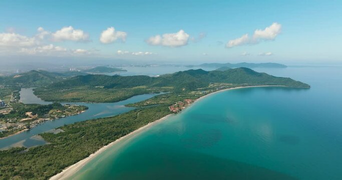 The coast of the island of Borneo by the beach and towns. Malaysia.