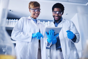Tablet, science and collaboration with a team working on research in a lab together for innovation or growth. Doctor, teamwork or medical with a black man and woman scientist at work in a laboratory