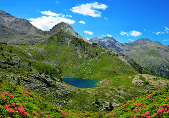 Naklejka na ściany i meble Mountain lake Lago di Loie in National park Gran Paradiso, Aosta valley, Italy. Summer landscape in the Alps.