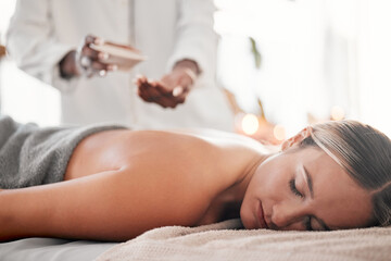 Obraz na płótnie Canvas Spa, oil and woman on a table for massage, wellness and skin treatment for peace, zen and relax. Luxury, girl and masseuse with skin product for massaging, therapy and healing in a beauty salon