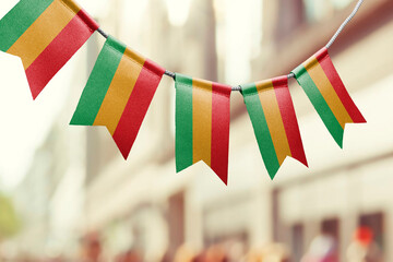 A garland of Bolivia national flags on an abstract blurred background