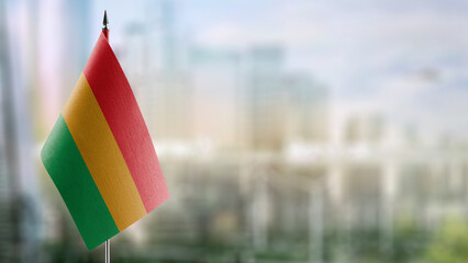 Small flags of the Bolivia on an abstract blurry background