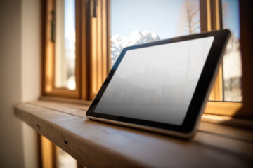 Situated in a cozy mountain chalet with stunning views of the snowcapped Alps, this is the perfect place to work on a tablet pc remotely and get productive. AI generative