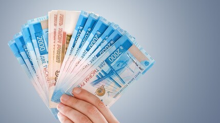 Hand Holding set of money notes