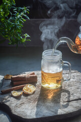 Tea hot drink on old background in composition on the table