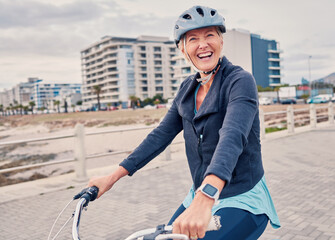 Fitness, promenade and woman riding a bicycle for exercise, health and wellness by the beach....