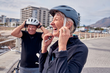 Helmet, laughter and a senior couple cycling outdoor together for fitness or an active lifestyle. Summer, exercise or humor with a mature man and woman laughing on the promenade during summer © Courtney H/peopleimages.com