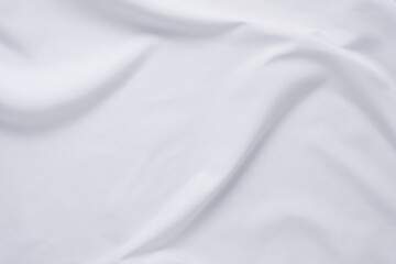 Obraz na płótnie Canvas White fabric. luxurious white fabric texture background. Creases of satin, silk and cotton.
