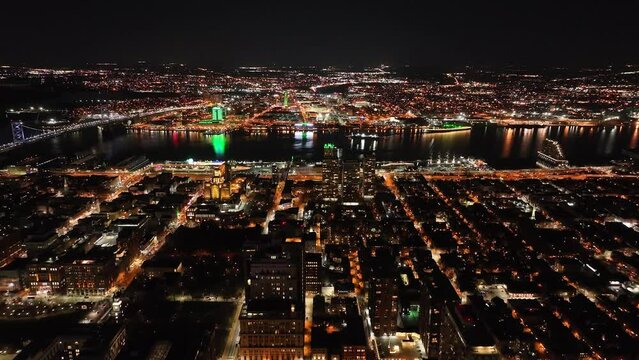 Aerial View of Center City Philadelphia and Camden City NJ Waterfront at Night Lit Green for Philadelphia Eagles Superbowl
