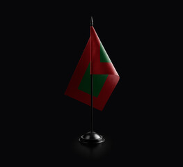 Small national flag of the Maldives on a black background