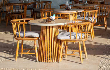 Tables with chairs in a cafe.