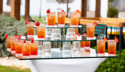 Cocktail with strawberries in nature.