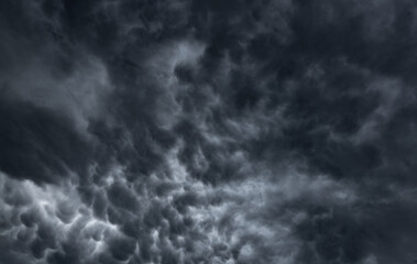 dark clouds make sky in black. Heavy rain thunderstorm. Pattern of clouds overcast predict tornado, Hurricane or thunderstorm and rainy. Dark sky cloudy have storm and lightning thunderbolt.