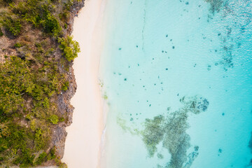 This drone shot of Nungwi Beach in Zanzibar captures the incredible beauty of the shoreline, with crystal-clear waters and golden sand providing a picture-perfect view.