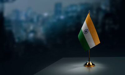 A small India flag on an abstract blurry background