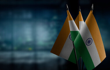 A small India flag on an abstract blurry background
