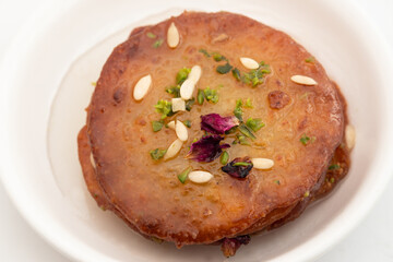 Juicy Sugary Pancakes Sweets Also Called Malpua, Pooa Or Pua Are Traditional Indian Dessert Mithai Drenched, Dunked, Soaked Or Dip In Sugar Syrup Cheeni Ki Chasni. Enjoyed On Holi, Navratri and Diwali