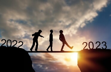 New year of 2023. Walking people on rock