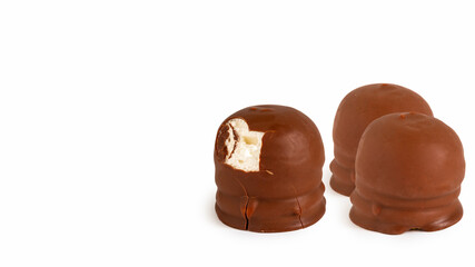 Israeli winter dessert Krembo (cool whip candy) on white background with copy space.