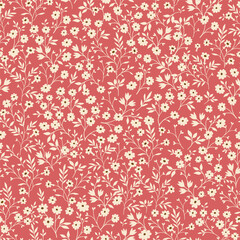 Vintage seamless tiny floral pattern. Salmon background with small light yellow flowers. Design for wallpaper, clothing, packaging, fabric, cover, textiles