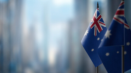 Small flags of the Australia on an abstract blurry background