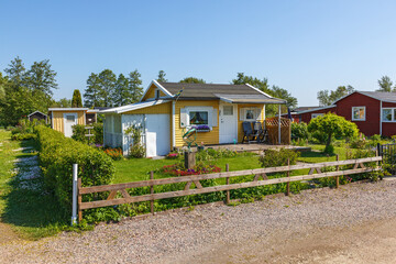 Fototapeta na wymiar Idyllic allotment garden with a small cottage