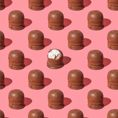 Seamless pattern with Israeli winter dessert Krembo (cool whip candy) on pink background.