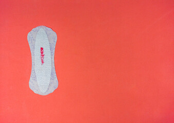 menstruation cycle in women, laying on a carrot background, top view