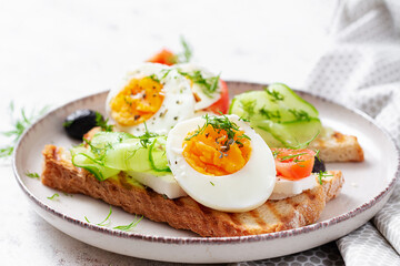 Healthy breakfast. Toast with feta cheese and egg. Healthy balanced food.