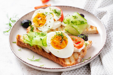 Healthy breakfast. Toast with feta cheese and egg. Healthy balanced food.