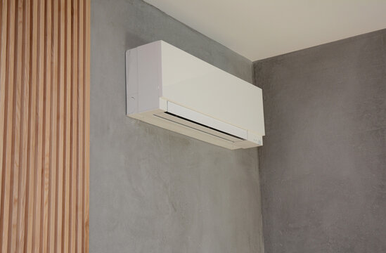 Close up on Ac Unit i modern house interior. Indoor AC unit wall mounted.
