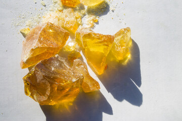pieces of pine rosin, yellow-burnt amber stones