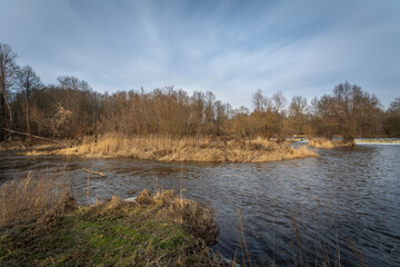 The Warta River in the month of February at the heights of the city of Dzialoszyn, Poland.