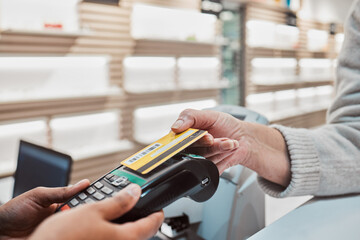 Hands, credit card and machine for payment, banking transaction or ecommerce at eye clinic or...