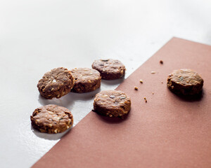 Scattered round brown small cookies