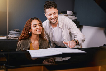 Artists, piano and people playing music in a creative or recording studio with a song book. Art, musicians and couple in production writing of album or sound track together with a musical instrument.