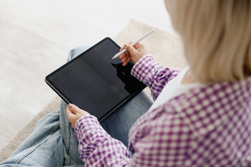 Cropped young woman wear casual clothes graphic designer hold work use write draw stylus pc pen...