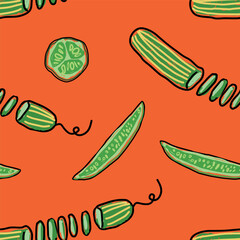 Sliced long striped cucumbers across in circles and lengthwise on an orange background