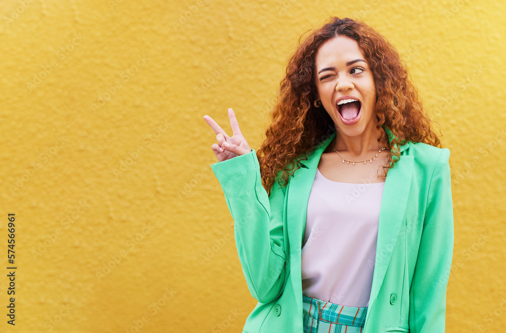 Canvas Prints Woman, peace and wink on yellow background, color backdrop and mockup space. Happy female, v sign and hands of cool model for victory, winking and fun mood with happiness, mock up and gen z fashion