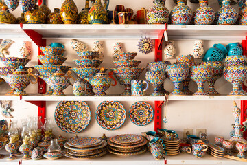 Tahran, Iran - 17th june, 2022 : special decorative iranian plates in on shelves in local shop in...